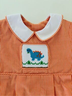 Remember Nguyen - Orange Gingham Kids One-Piece with Blue Dinosaur Smocked Patch